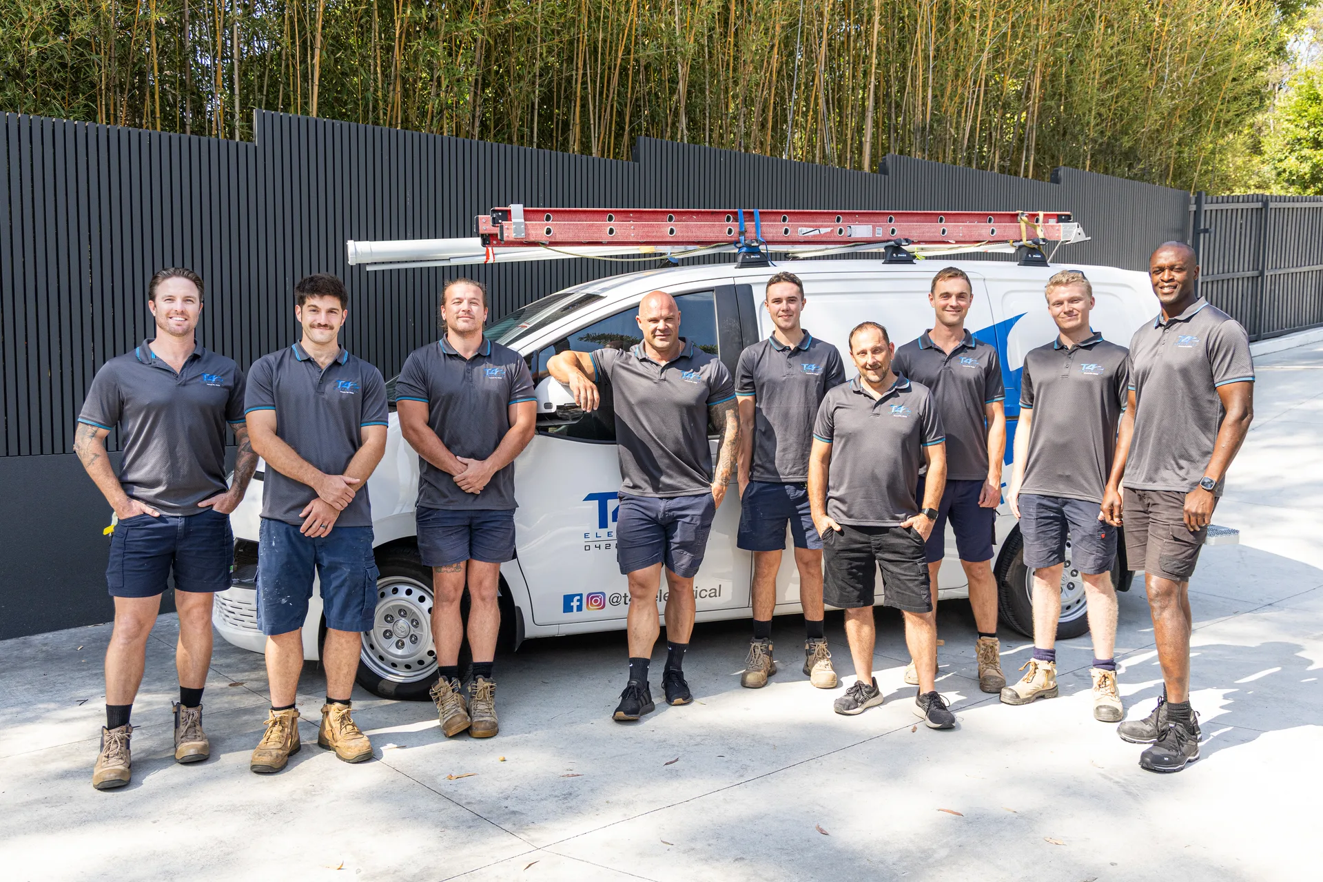 The Family Electrician Varsity Lakes team with a service van